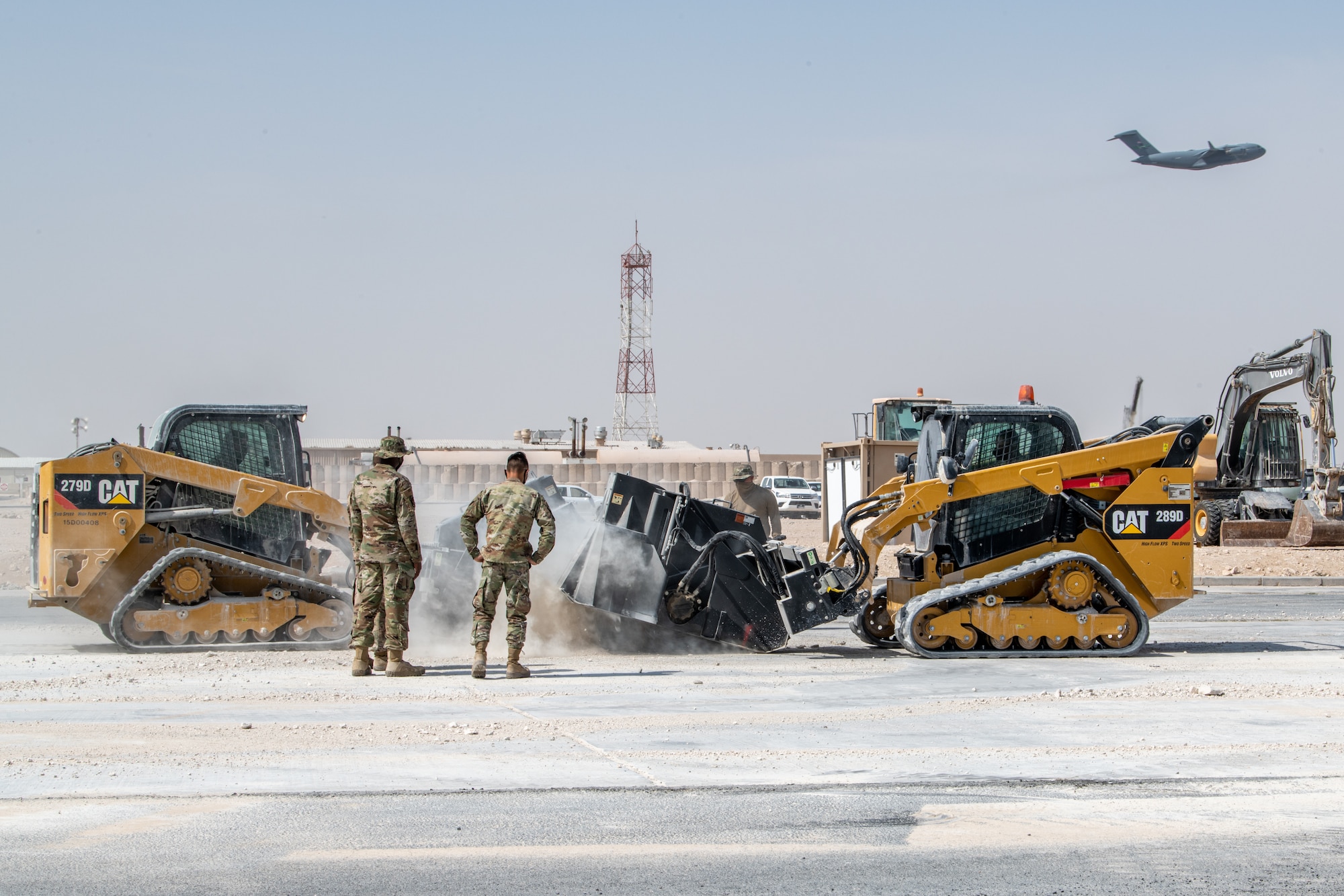 U.S. Airmen assigned to the 379th Expeditionary Civil Engineer Squadron perform rapid airfield damage repair during a training event March 3, 2021, at Al Udeid Air Base, Qatar.
