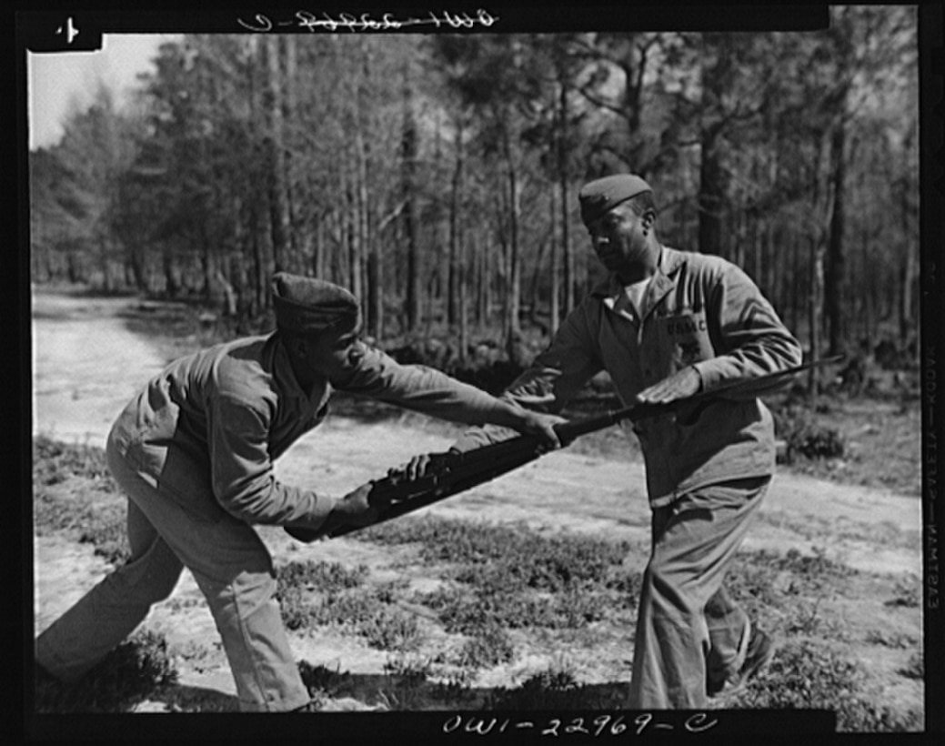 Cpl. Arvin L. Ghazlo demonstrates to a bayonet class a technique for disarming the enemy. Breaking a tradition of 167 years, the Marine Corps started enlisting blacks, June 1, 1942.