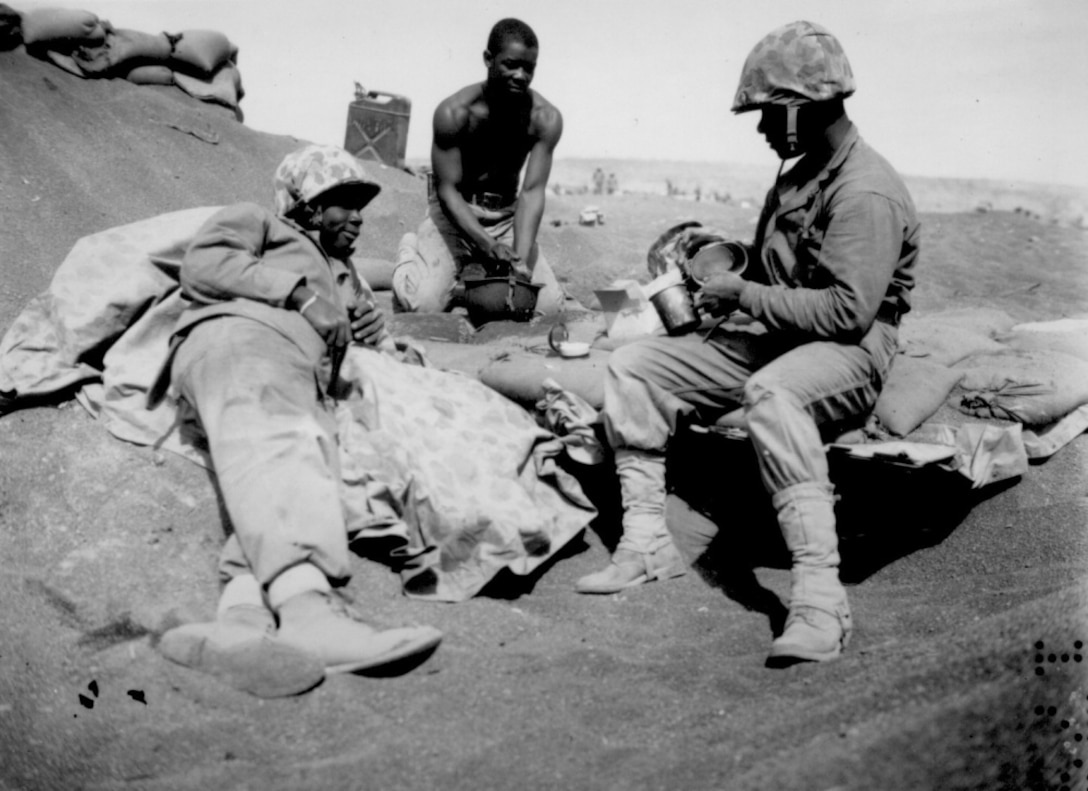 Black Marines on the beach at Iwo Jima are, from left to right, Pfc.'s Willie J. Kanody, Elif Hill and John Alexander, March 1945.