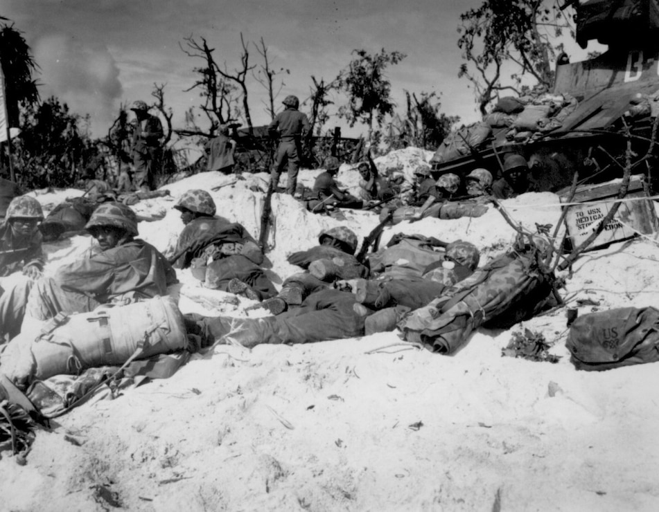 Marines move through the trenches on the beach during the Battle of Peleliu, Sept. 15, 1944.