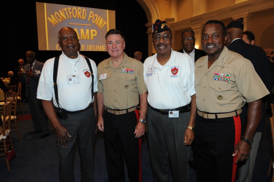 From left, J.T. Inge, U.S. Marine Lt. Gen. Terry Robling, the deputy commandant for aviation; Barnett Person; and Lt. Gen. Willie J. Williams, the director of Marine Corps Staff, pose for a photo during the breakfast in honor of Montford Marines at Crawford Hall at Marine Barracks Washington, Washington, D.C., Aug. 26, 2011.