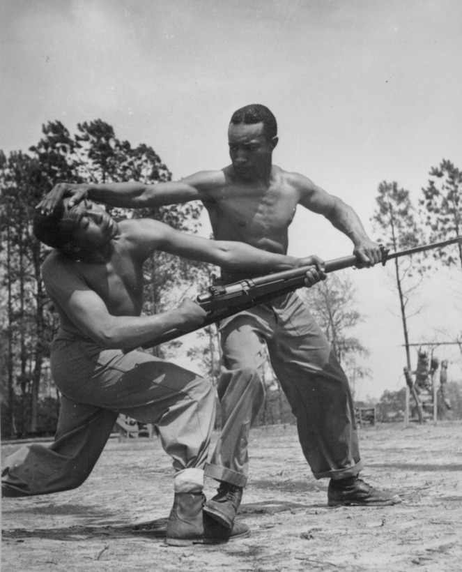 Cpl. Arvin Lou Ghazio, USMC, gives judo instructions to Pvt. Ernest C. Jones, April 1943.