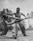 Cpl. Arvin Lou Ghazio, USMC, gives judo instructions to Pvt. Ernest C. Jones, April 1943.