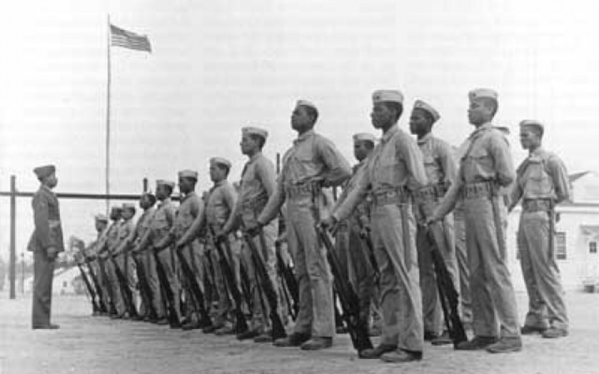 Marine Corps Cpl. Edgar R. Huff drills a platoon of recruits at Montford Point Camp, Camp Lejeune, North Carolina. He enlisted in the Marine Corps in June 1942.