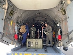 Coast Guard members fly COVID-19 vaccines around the West Coast using a C-27 Spartan aircraft in Alameda, Calif. February 18. 2021. Coast Guard Base Alameda, in the San Francisco Bay Area, is the only Coast Guard medical facility on the West Coast capable of storing the Pfizer vaccines at their necessary temperatures of -60C to -80C. (U.S. Coast Guard photo released)