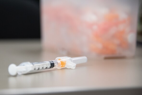 arm receiving vaccine shot