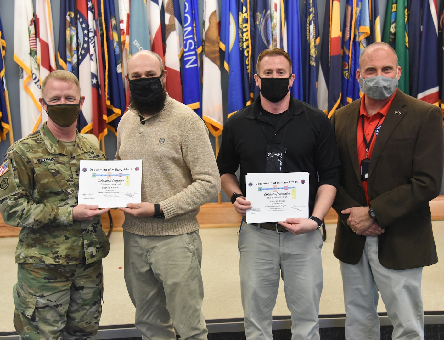 Participants in the Virginia Department of Military Affairs’ first-ever mentorship program graduate during a ceremony Feb. 25, 2021, at Fort Pickett, Virginia.