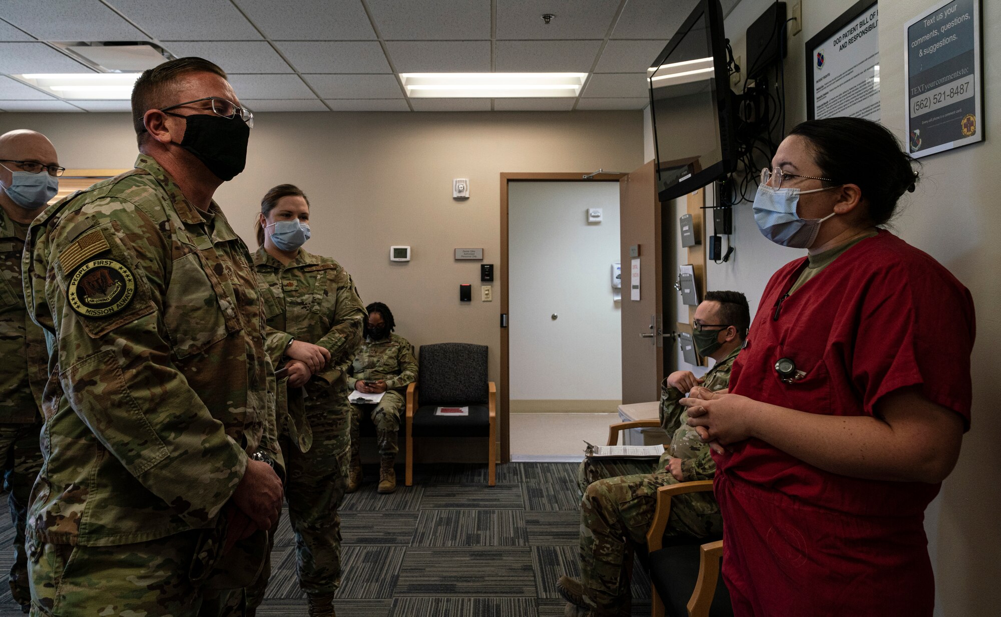 Wade listens to a briefing from Maria in the Creech Medical Clinic.