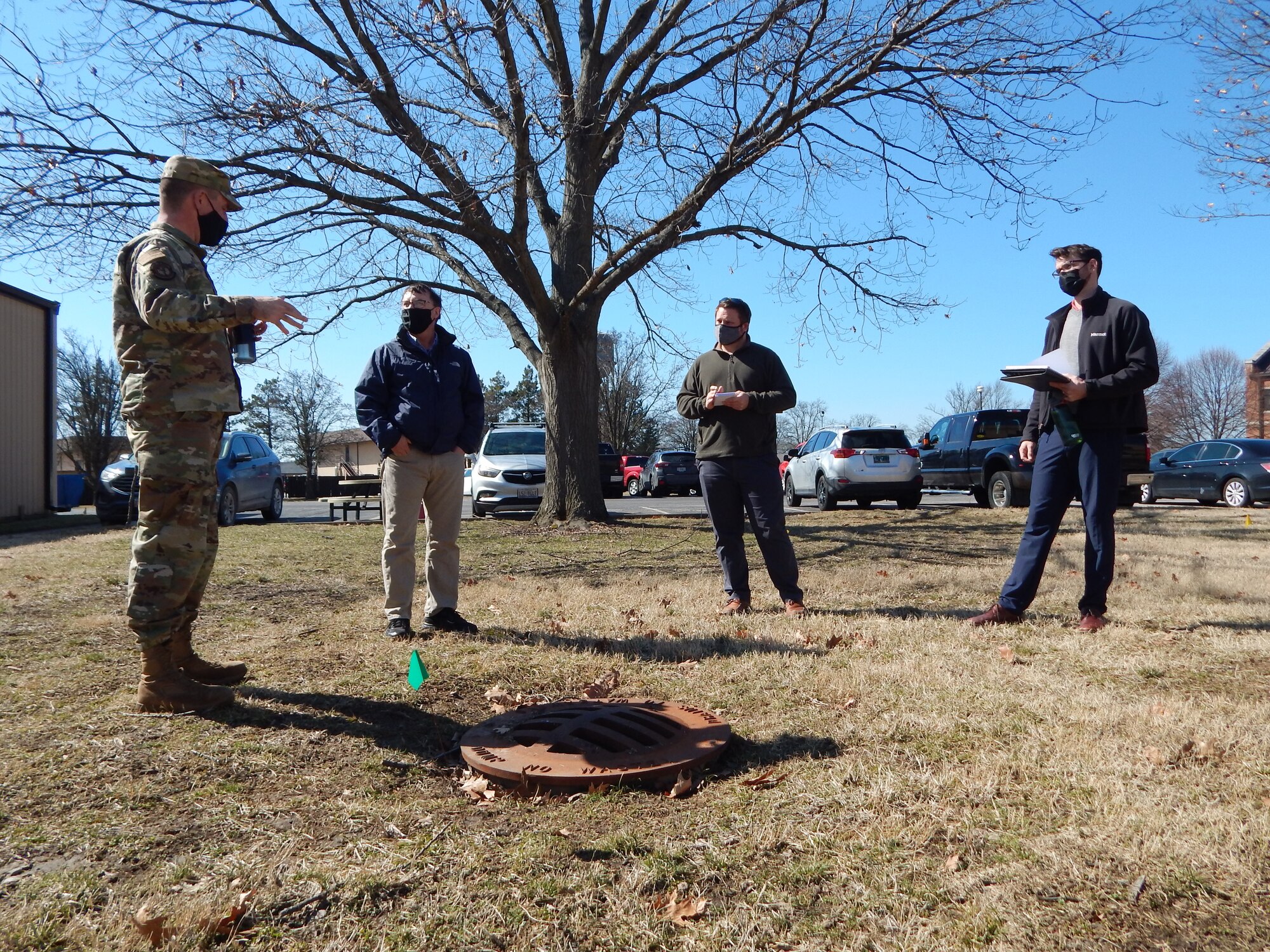 Lt. Col. Paul Fredin, commander of the 375th Civil Engineer Squadron, and 375th CES engineer Kenneth Cavanaugh (middle) talk with graduate students Cam Loyet and Kyle Collier (left to right) about water drainage at Hangar 3. The students visited the base on March 2, 2020, as part of their Innovating for Defense class at Washington University. Their class project is to identify potential solutions to prevent future flooding of Hangar 3, which sits in a low-lying area. The students will present their ideas to the Scott’s Elevate innovation team.