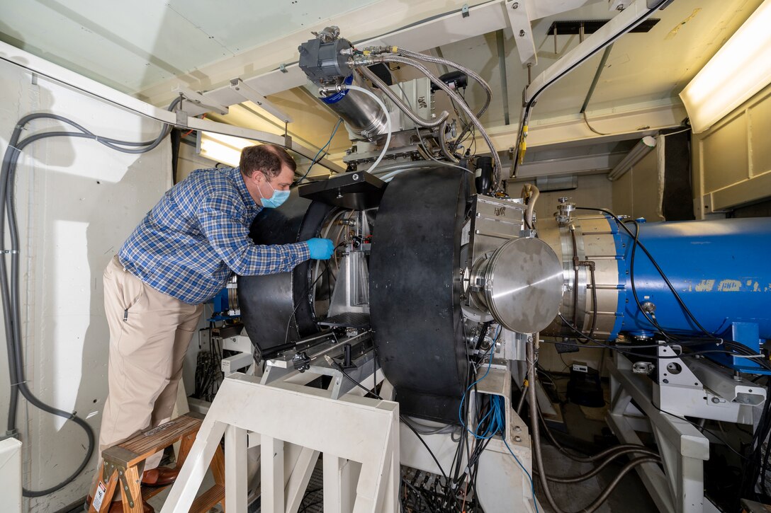 A man tests a laser.