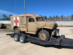 A World War II ambulance sits on a trailer at the Army Museum Support Center’s outdoor storage facility at Anniston, Alabama, Jan. 28 awaiting transport to the Alabama Center of Military History.