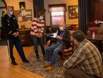 William Hills, of Freeport, Illinois, shows the U.S. flag and certificate presented to him by Illinois National Guard Lt. Col. Eric Smith, of Springfield, Illinois, Deputy G4, Illinois Army National Guard, to his family on a Facetime call on Hills’ 97th birthday Jan. 29.