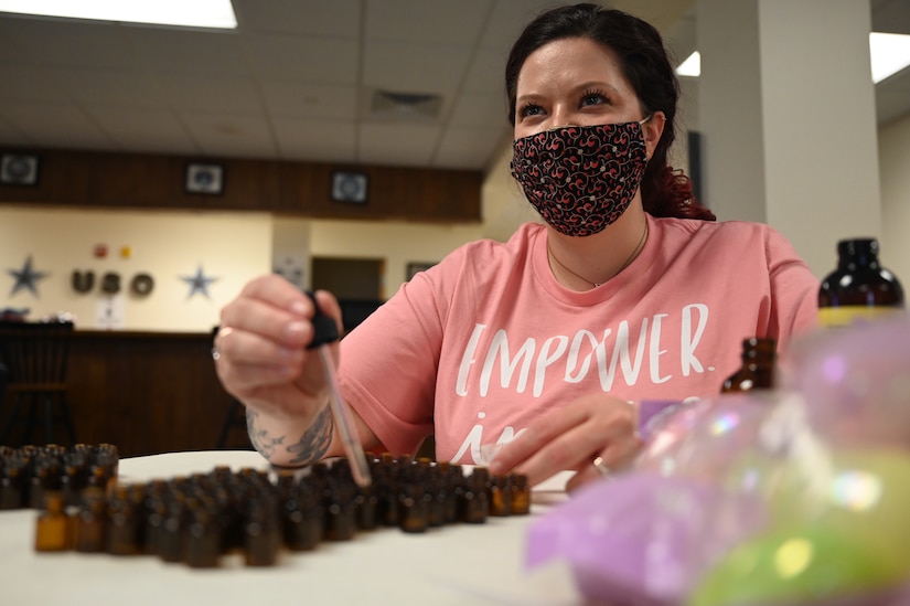 Kristin Celiceo, USO of Hampton Roads and Central Virginia program and volunteer coordinator, fills vials with essential oils to include in self-care packages for International Women’s Day at Joint Base Langley-Eustis, Virginia, Feb. 26, 2021.