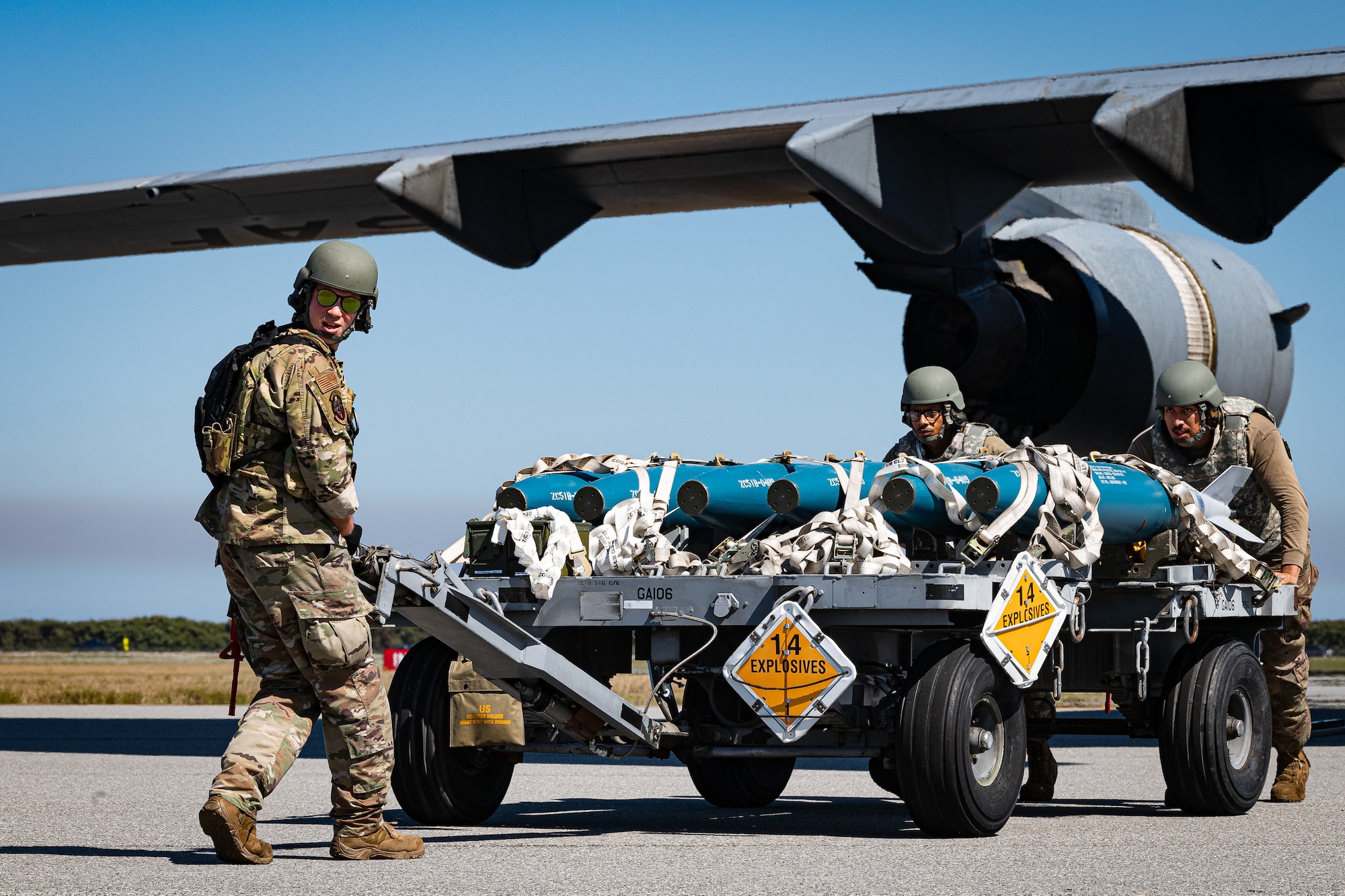 A photo of Airmen unloading a munitions trailer