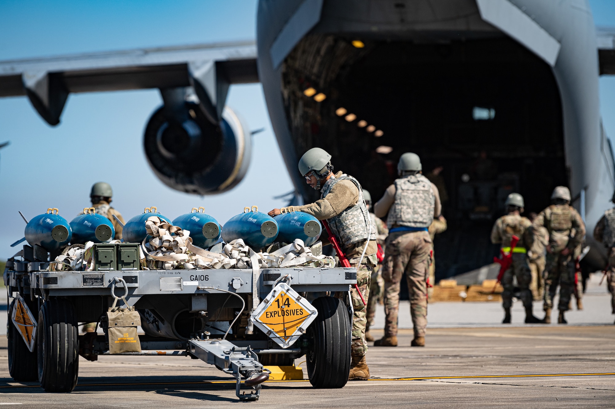 A photo of an Airman evaluating contents of a munitions trailer