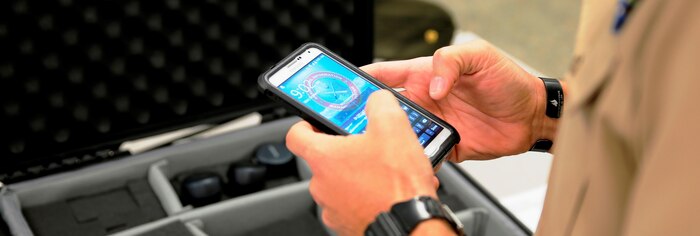 Marine handles MARCIMS-enabled device