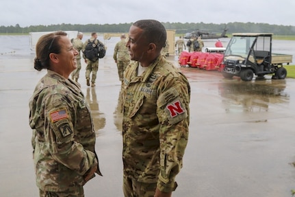 Chief Warrant Officer 5 Teresa Domeier, command chief warrant officer of the Army National Guard, speaks with Maj. Thomas Traylor of the Nebraska National Guard during the Guard's hurricane recovery efforts in North Carolina Sept. 16, 2018. Domeier is a native of Ceresco, Neb., and is the first female command chief warrant officer in the Guard's history.