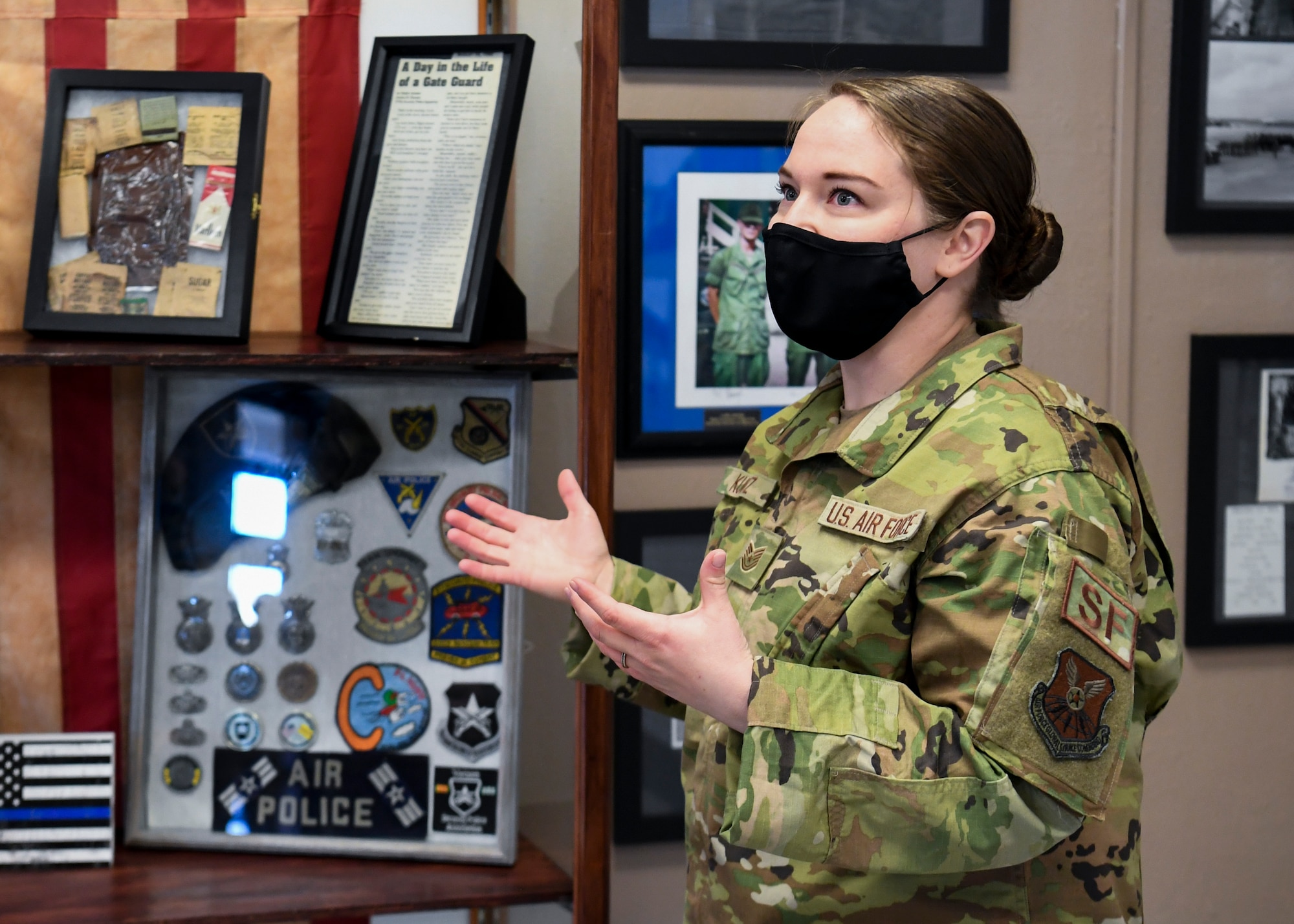 U.S. Air Force Tech. Sgt. Ashley A. Kurtz, 377th Security Forces Group flight chief, presents new artifacts added to the 377th Security Forces Group Heritage Room.