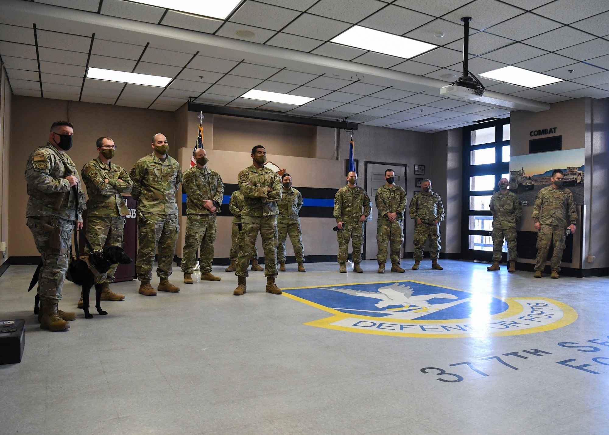 Members of Team Kirtland gather for the unveiling of the recently renovated 377th Security Forces Group Heritage Room.