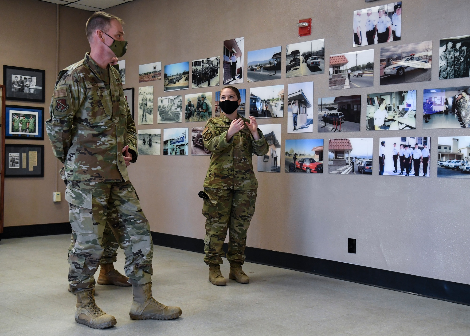 U.S. Air Force Col. David S. Miller, 377th Air Base Wing commander, learns about the updates to the Heritage Room.