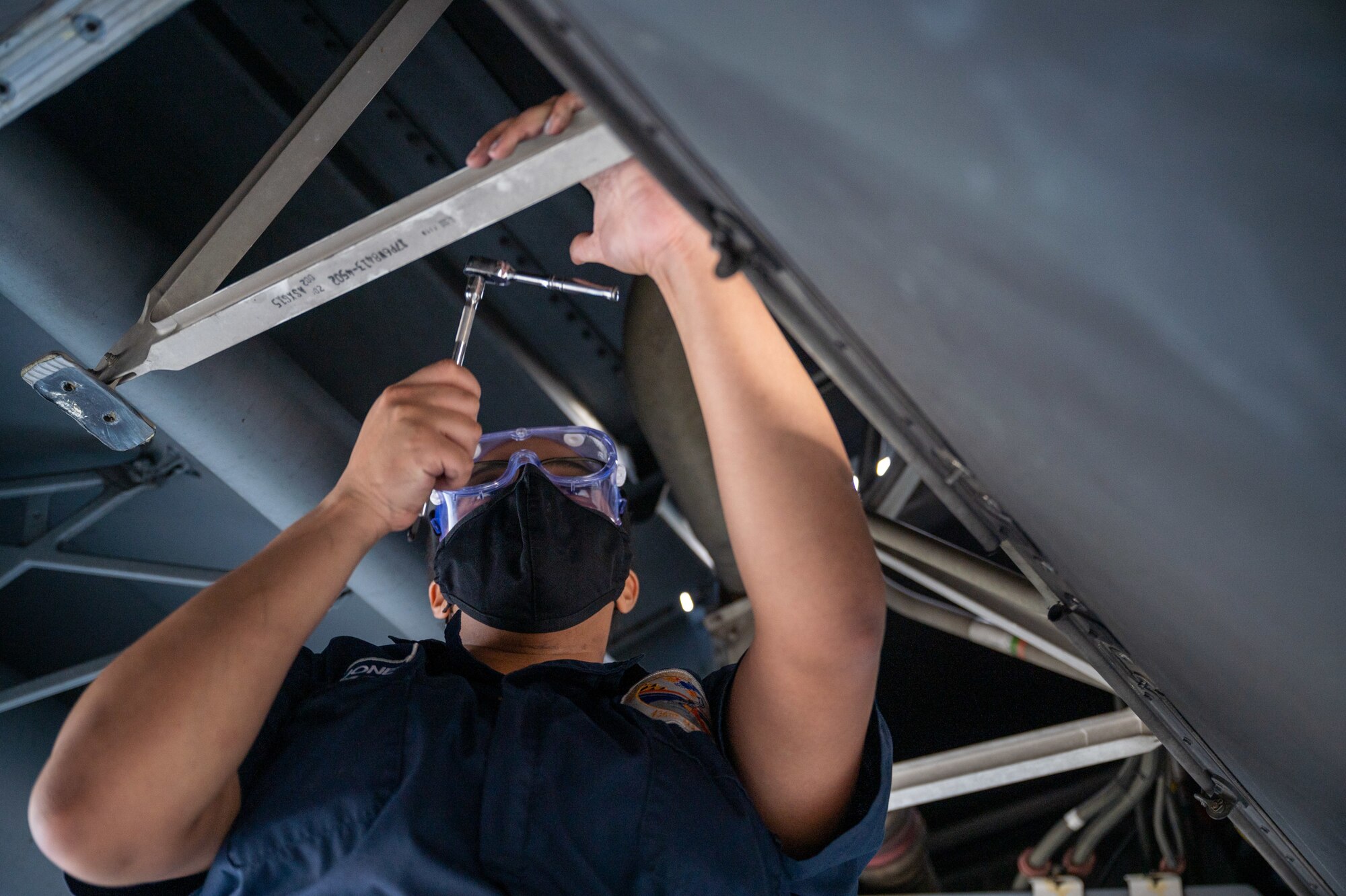 Airman 1st Class Adrienne Jones, 436th Maintenance Squadron fuels journeyman, replaces an actuator in the wing of a Dover Air Force Base C-17 Globemaster III at Moody AFB, Georgia, Feb, 28, 2021. Aircrew from the 3rd Airlift Squadron identified a faulty plug housing on the C-17 following the completion of Exercise Mosaic Tiger. A three-Airmen Maintenance Recovery Team from Dover AFB was alerted and mobilized within 24 hours. The MRT, along with the flying crew chief assigned to the C-17, coordinated parts and tools from Joint Base Charleston, South Carolina, to ensure the successful return of the aircraft to Dover AFB. (U.S. Air Force photo by Airman 1st Class Faith Schaefer)