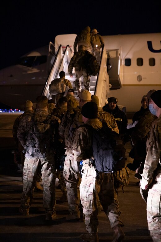 Alaska Army National Guard Soldiers with Alpha Company and the associated detachments of the 1-168th General Support Aviation Battalion get ready at the Joint Mobility Center on Joint Base Elmendorf-Richardson to depart for a nine-month long deployment to the Middle East, March 7, 2021. The Soldiers departed late at night on Sunday and will spend approximately a few months mobilizing in Ft. Hood, Texas, before they reach their final destination. (U.S. Army National Guard photo by Spc. Grace Nechanicky)