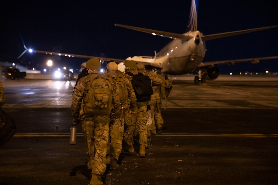 Alaska Army National Guard Soldiers with Alpha Company and the associated detachments of the 1-168th General Support Aviation Battalion get ready at the Joint Mobility Center on Joint Base Elmendorf-Richardson to depart for a nine-month long deployment to the Middle East, March 7, 2021. The Soldiers departed late at night on Sunday and will spend approximately a few months mobilizing in Ft. Hood, Texas, before they reach their final destination. (U.S. Army National Guard photo by Spc. Grace Nechanicky)