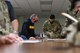 A photo of Airmen processing through a deployment line