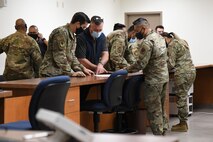 A photo of  Airmen processing through the deployment line