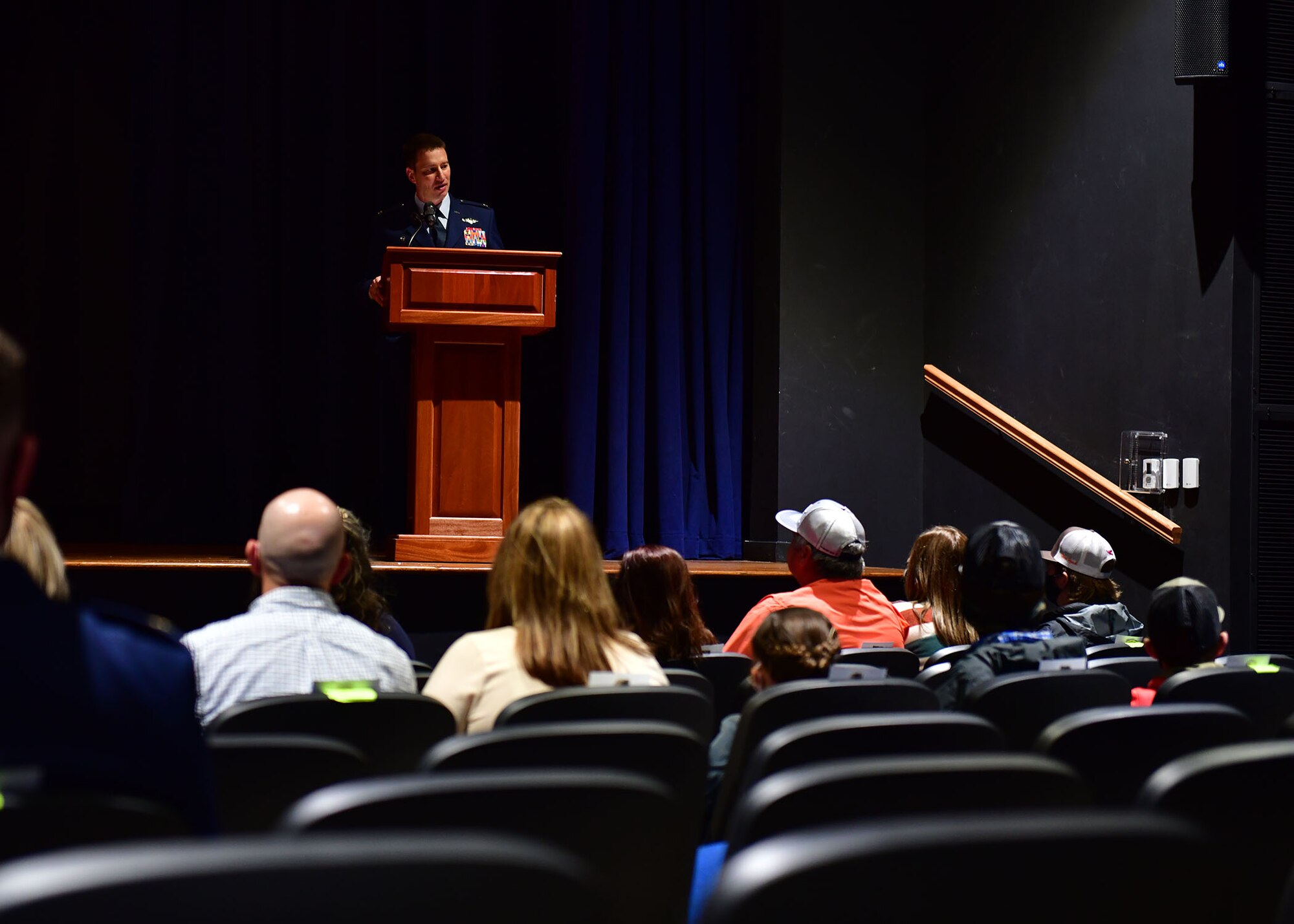 A person speaks during a ceremony