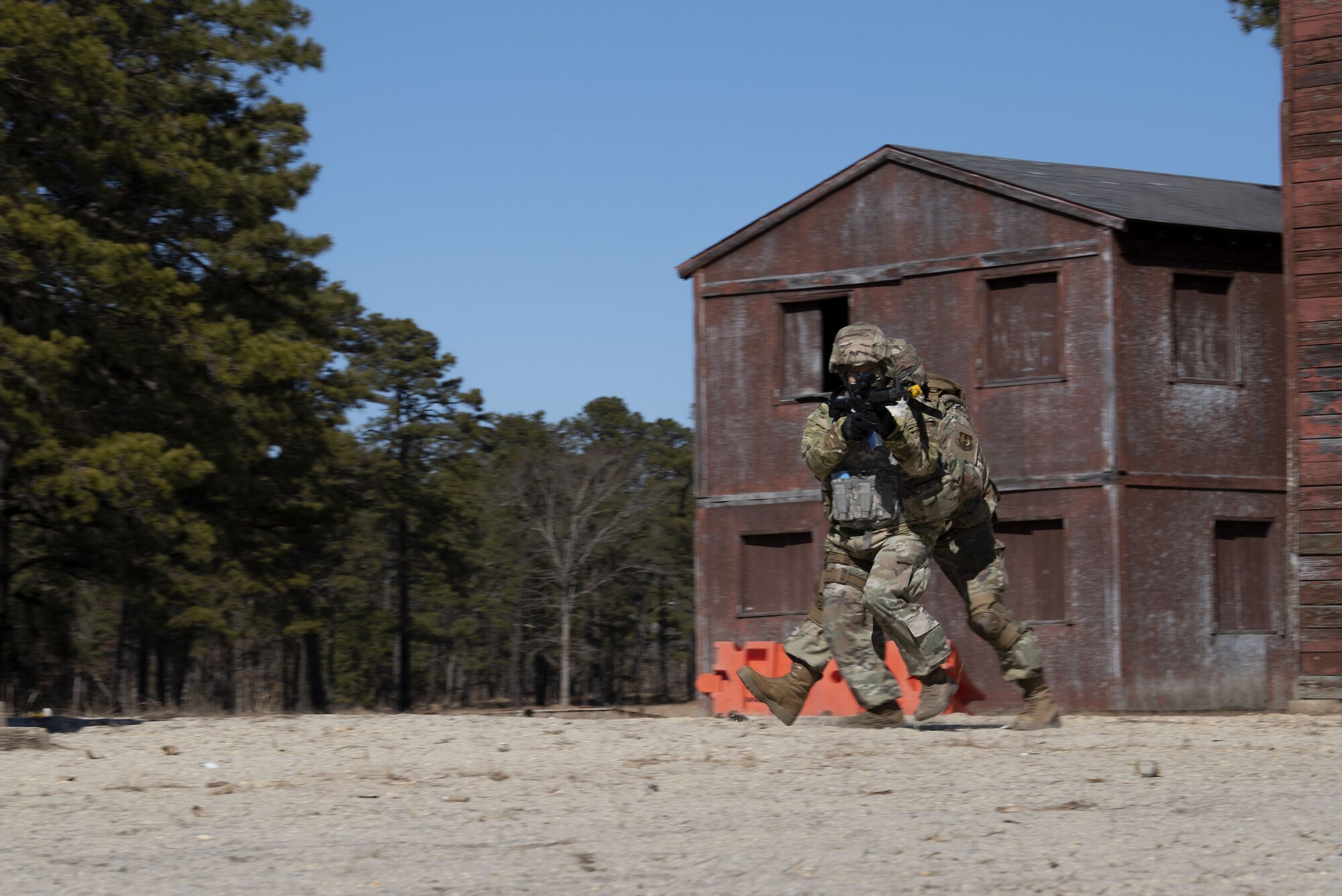 Photo of Airmen returning fire during pre-deployment training.