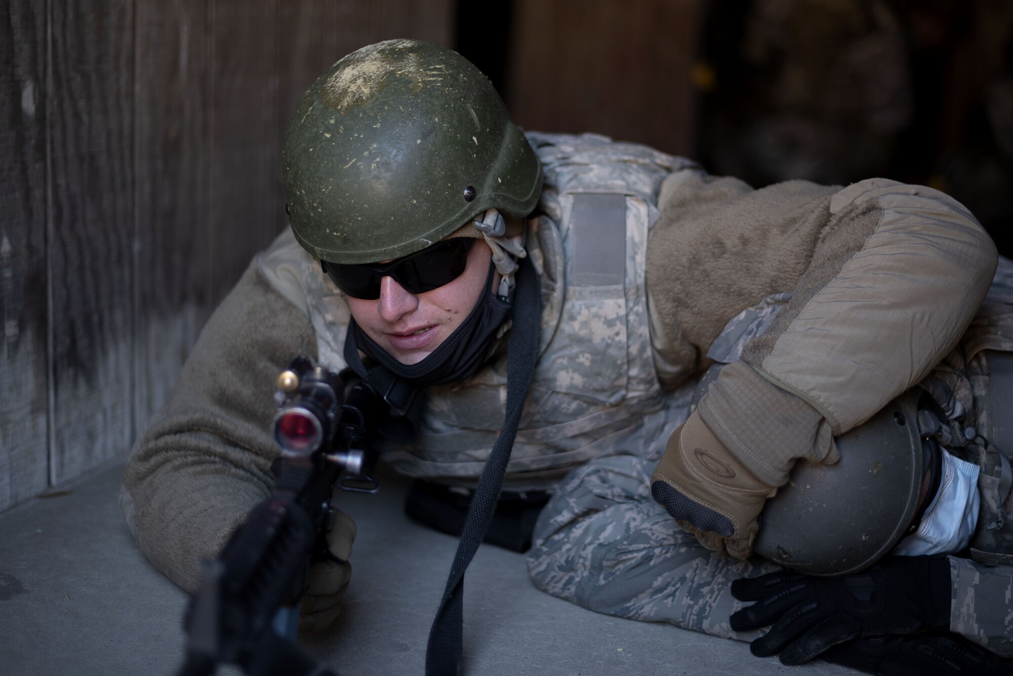 Photo of a religious support Airman protecting his chaplain during pre-deployment training.