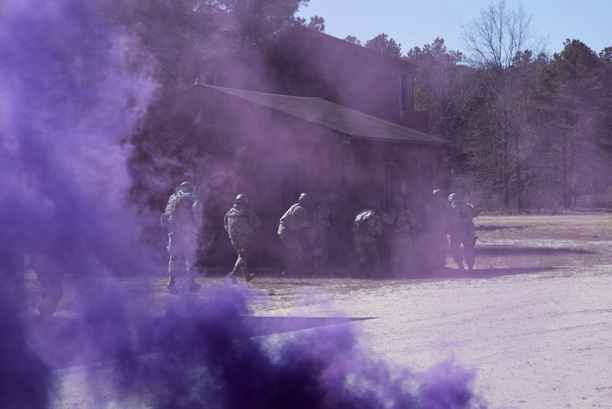 Photo of Airmen seeking cover during pre-deployment training.