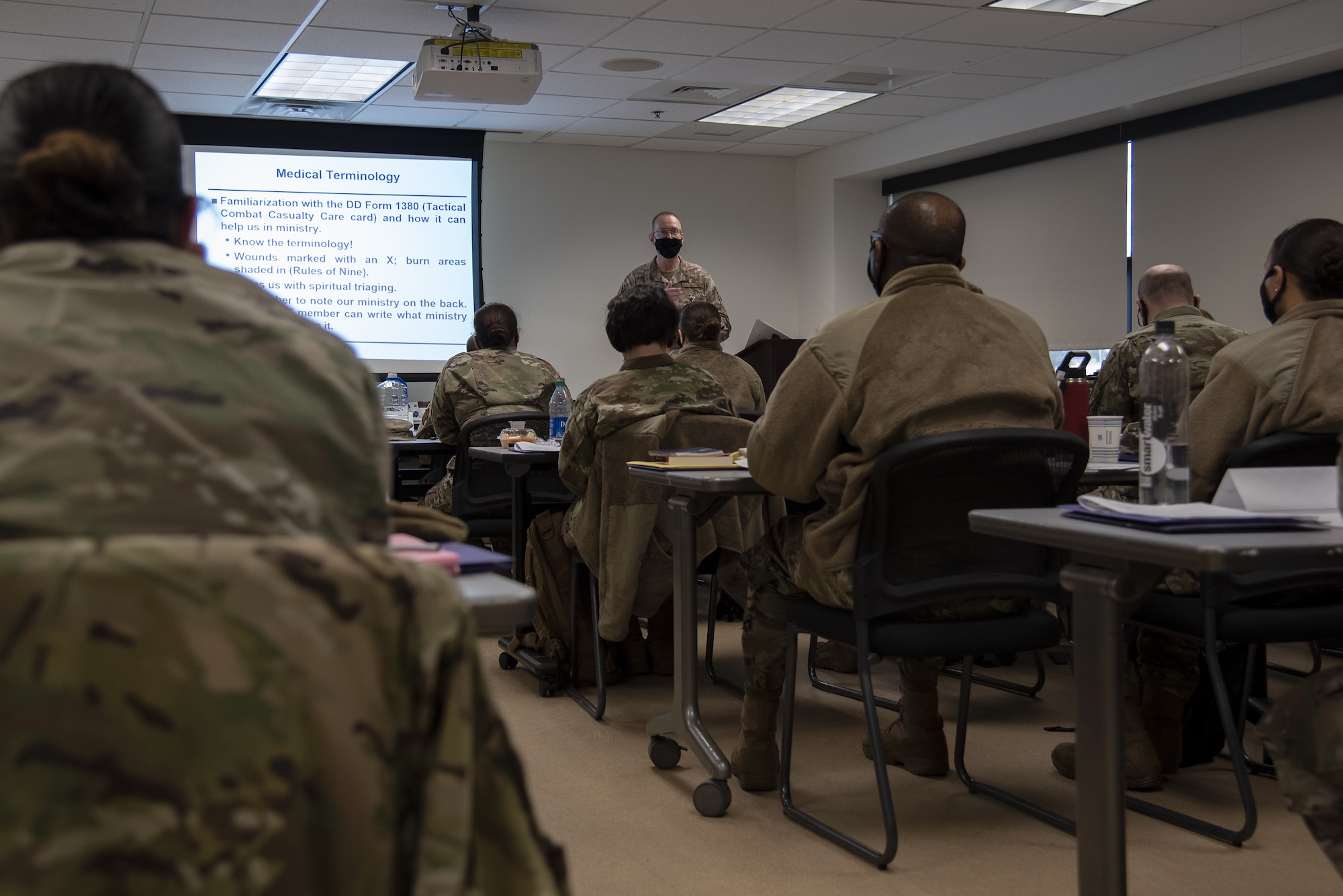 Photo of Airmen in a classroom during pre-deployment training.