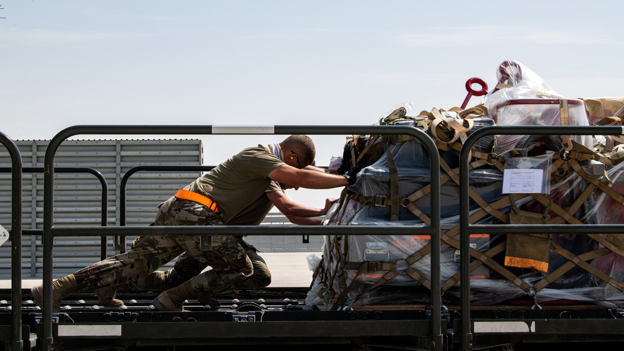 airmen moving cargo