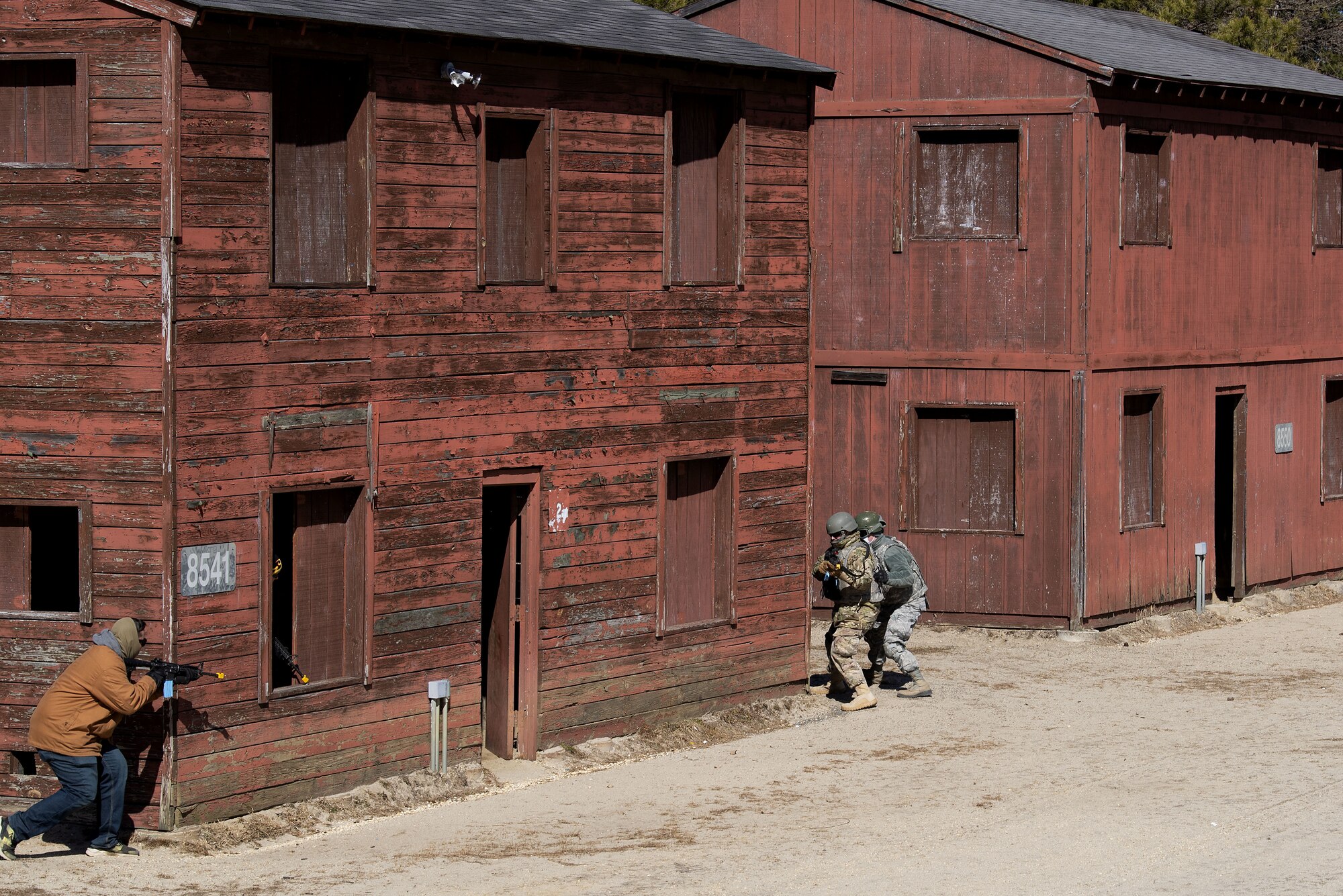Photo of Airmen taking cover during pre-deployment training.