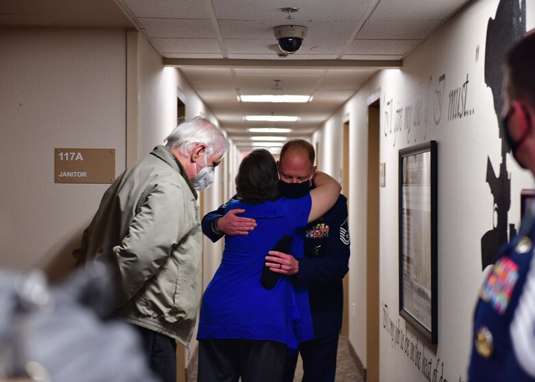 Two people hug