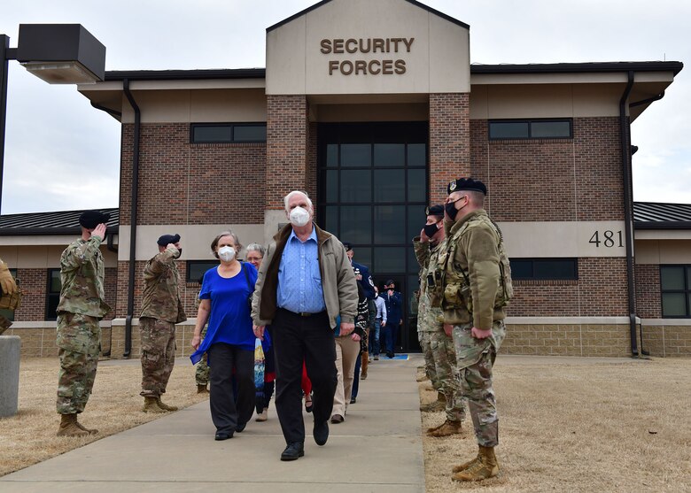 Airmen salute a family