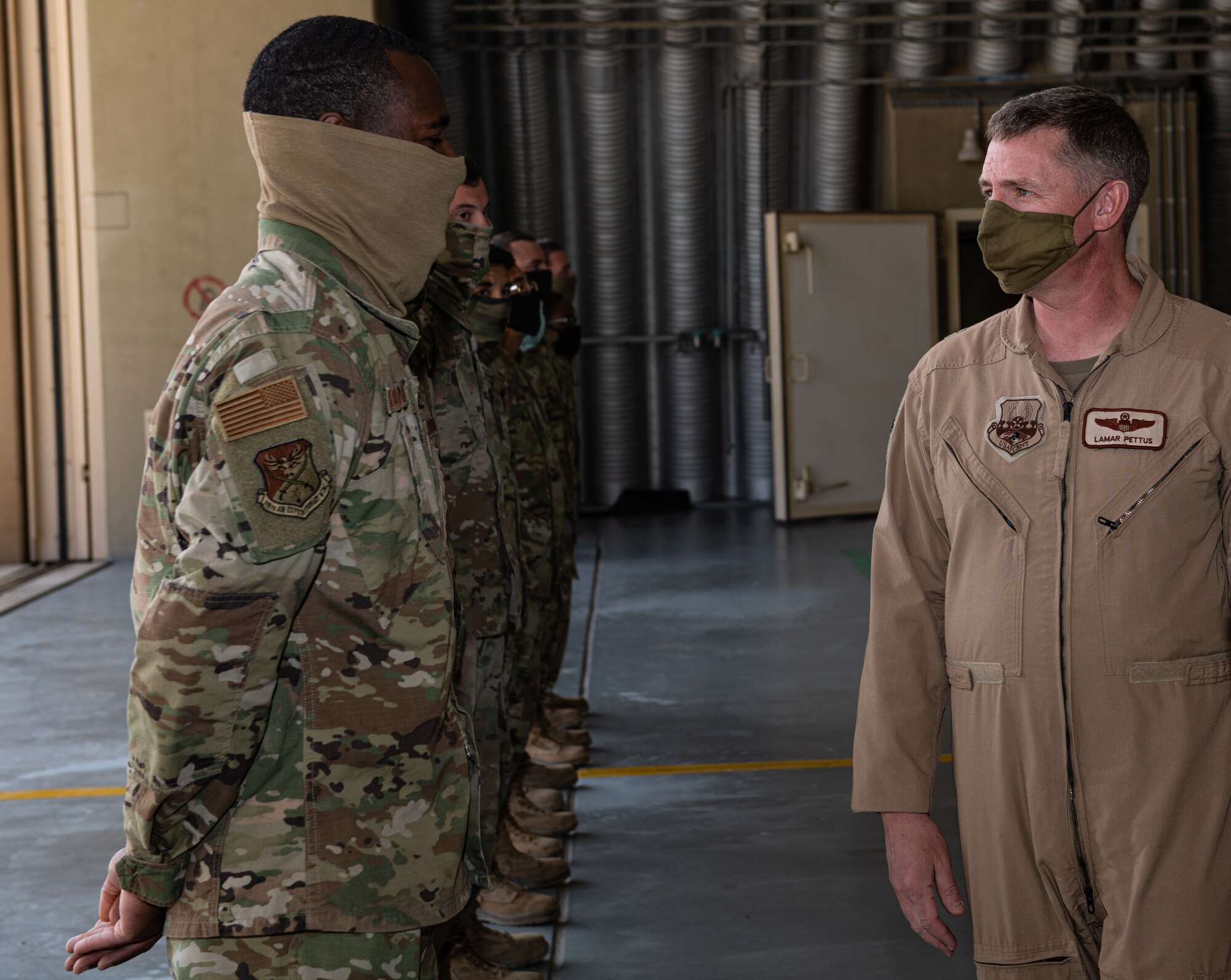Brig. Gen. Evan Pettus, 378th Air Expeditionary Wing commander, speaks with Airmen from the 378th Expeditionary Maintenance Squadron ahead of an Agile Combat Employment capstone event Feb. 27, 2021, at an airbase in the Kingdom of Saudi Arabia.