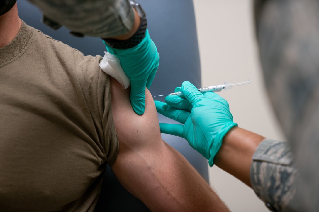 413th ASTS administers COVID vaccine