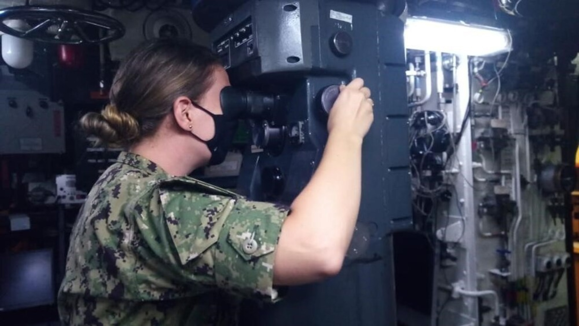 Lt. Taylor Butler, an Olmsted Scholar currently pursuing a Master’s degree in Brazil, uses a stadometer to estimate range with the attack periscope aboard the Brazilian Navy Submarine BNS Tupi (S30), March 4, 2021. Butler embarked on Tupi for four days at sea to help increase the exchange of knowledge between U.S. and Brazilian submarine forces. U.S. Naval Forces Southern Command/U.S. 4th Fleet supports USSOUTHCOM joint and combined military operations by employing maritime forces in cooperative maritime security operations in order to maintain access, enhance interoperability and build enduring partnerships that foster regional security and promote peace, stability and prosperity in the Caribbean, Central and South American regions. (Courtesy U.S. Navy photo/Released)