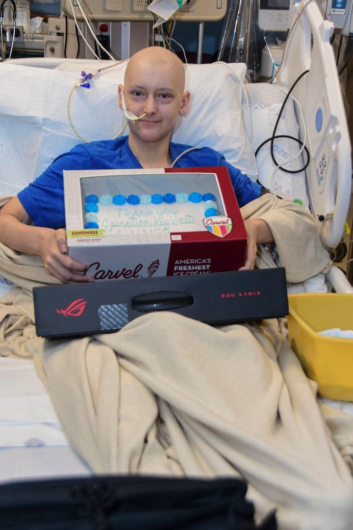 Taylor Roberts, patient at Naval Medical Center Portsmouth’s (NMCP) Pediatric Oncology Department, receives a gift from Operation Key West, March 4.