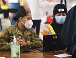 More than 30 Virginia National Guard Soldiers train on providing administrative and logistics support to a COVID-19 vaccination site March 1, 2021, at Richmond Raceway in Henrico County, Virginia.