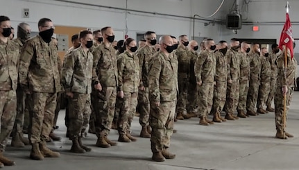 Soldiers with Bravo Company, 572nd Brigade Engineer Battalion, stand at attention during a deployment ceremony in Vergennes, Vermont, March 9, 2021. The Soldiers will deploy to the U.S. Africa Command area of responsibility. (U.S. Army National Guard photo by Josh T. Cohen)