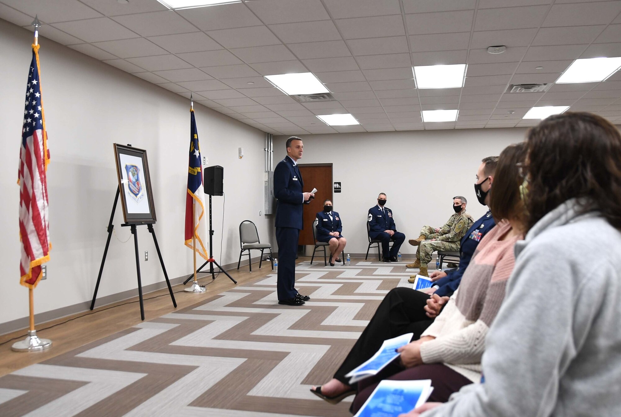 U.S. Air Force Col. Joseph H. Stepp IV, 145th Airlift Wing (AW) commander, remarks on the character of the 145th AW Command Chief Master Sgt. Susan A. Dietz, and the incoming Command CMSgt William R. Harper, Jr. during a Change of Authority Ceremony held at the North Carolina Air National Guard Base, Charlotte Douglas International Airport, March 6, 2021. Command CMSgt Dietz, relinquishes authority of the 145th AW Command Chief position as CMSgt Harper, accepts authority.