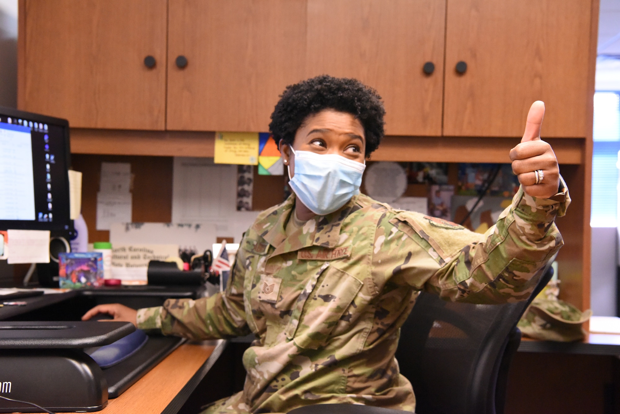 U.S. Air Force Tech. Sgt. Devan Abram, 145th Airlift Wing recruiter, pauses to discuss the new hair regulations at the North Carolina Air National Guard Base, Charlotte Douglas International Airport, Mar. 6, 2021. Effective Feb. 2021, Air Force females are allowed to wear one or two braids, or a ponytail not exceeding the length of their underarm inseam. They may also have bangs that touch their eyebrows.