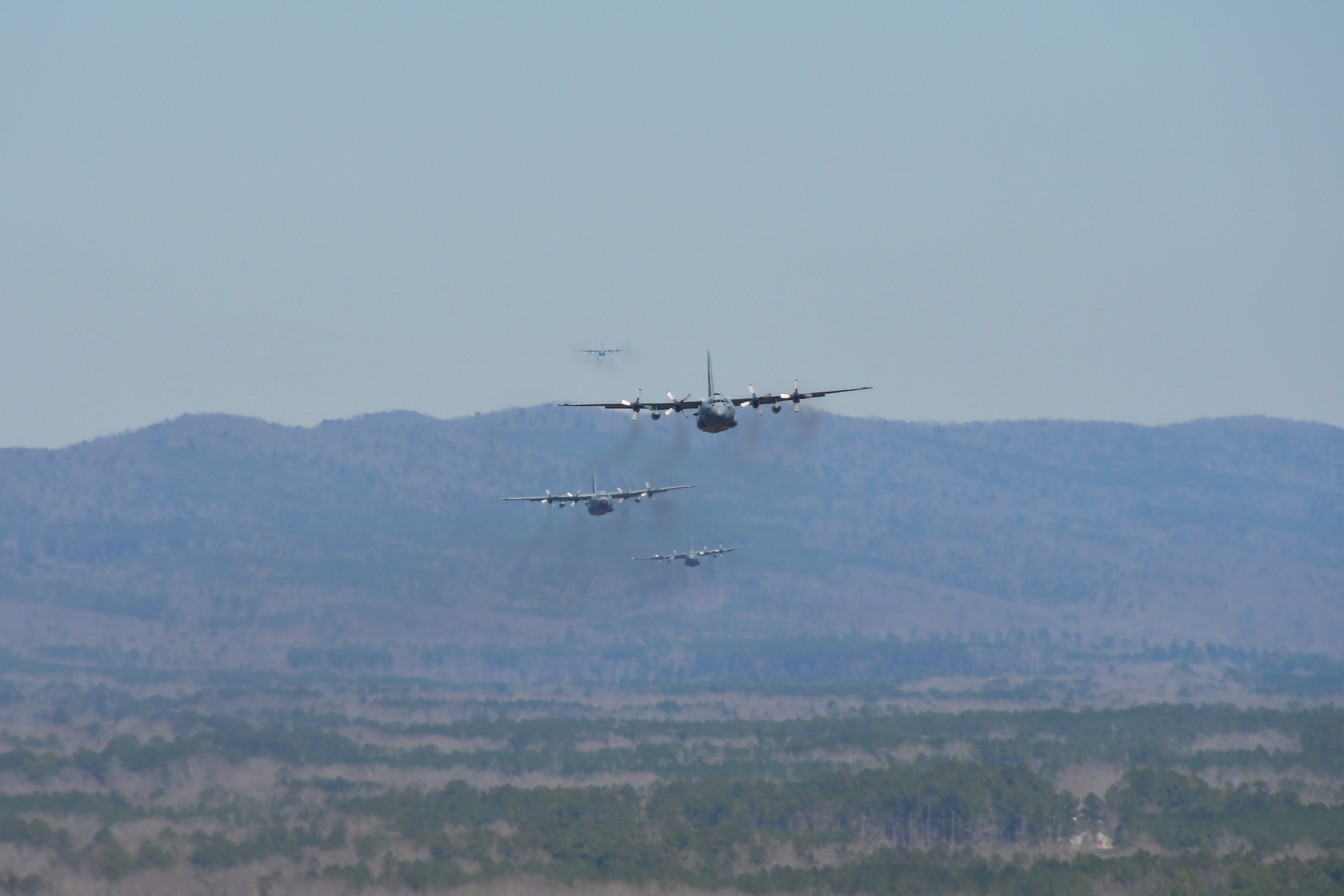 Multiple C-130 Hercules aircraft fly over Rome, Ga. March 4, 2021. Dobbins Air Reserve Base worked together with aircrew from Maxwell Air Force Base and Peoria Air National Guard Base for formation exercise Baltic Wolf 2021. (U.S. Air Force photo by Senior Airman Kendra A. Ransum)