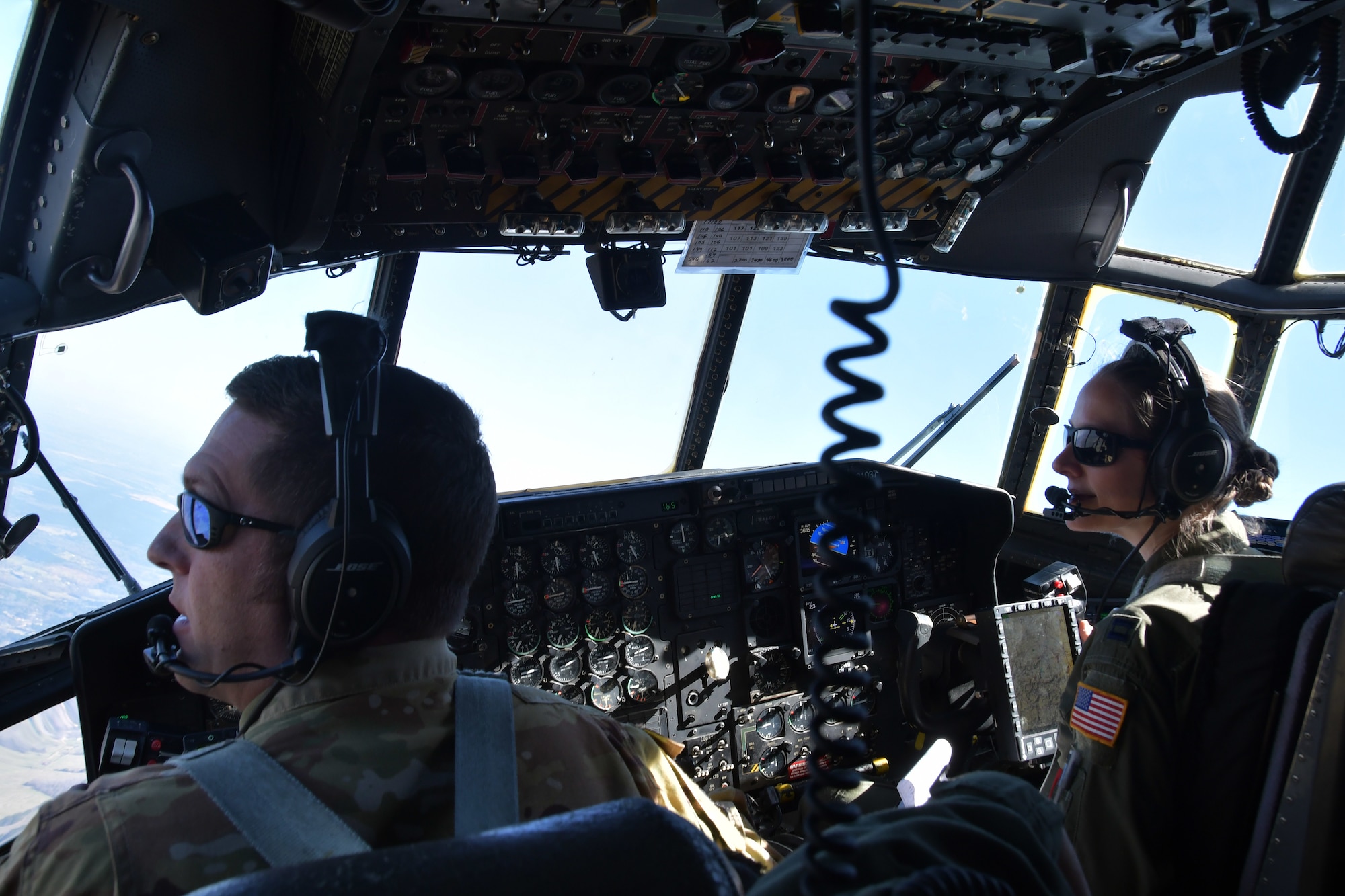 Maj. Andrew F. Smith and Capt. Latessa R. Meader, both 700th Airlift Squadron pilots, fly over Rome, Ga. March 4, 2021. Multiple C-130s flew together as part of Baltic Wolf 2021, a large formation exercise incorporating other units within the Air Force Reserve Command. (U.S. Air Force photo by Senior Airman Kendra A. Ransum)