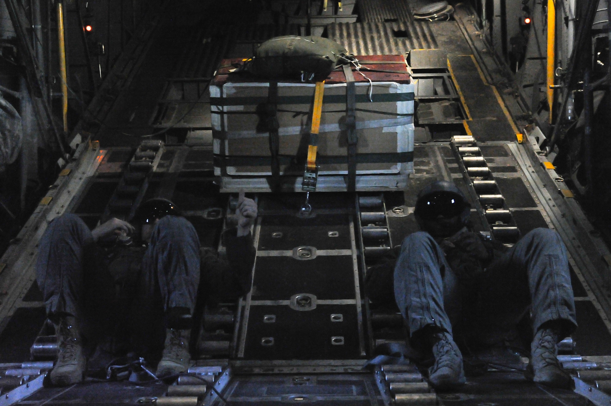 Master Sgts. Andrew S. Cline and Antwun T. Cotton, both 94th Operations Support Squadron loadmasters, prepare to drop a Low-Cost-Low-Altitude airdrop over Rome, Ga. March 4, 2021. Multiple C-130s flew together as part of Baltic Wolf 2021, a large formation exercise incorporating other units within the Air Force Reserve Command. (U.S. Air Force photo by Senior Airman Kendra A. Ransum)