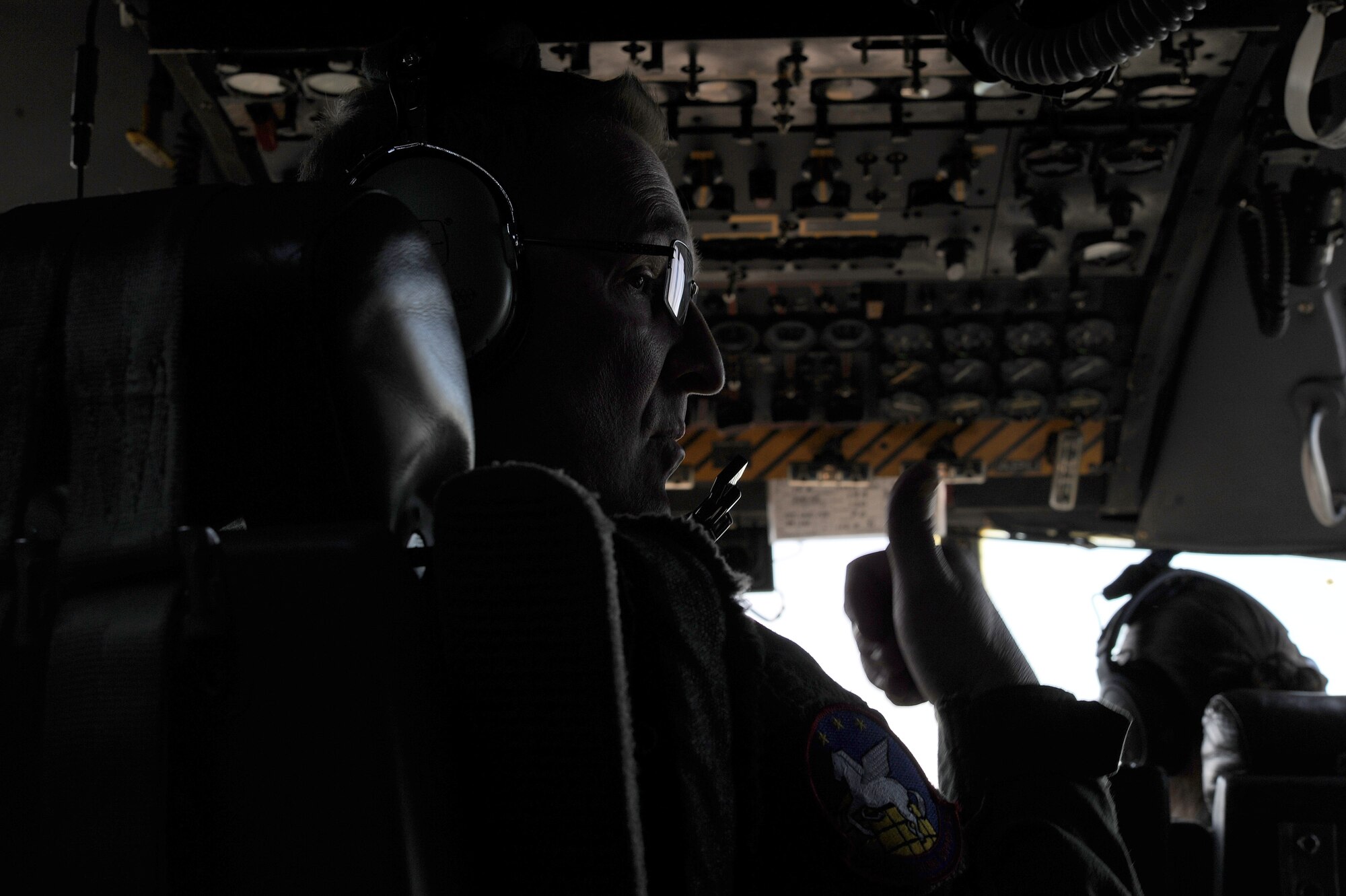 Tech. Sgt. Paul D. Purcell, a 700th Airlift Squadron flight engineer, gives a thumbs up while flying over Rome, Ga., March 4, 2021. Multiple C-130s flew together as part of Baltic Wolf 2021, a large formation exercise incorporating other units within the Air Force Reserve Command. (U.S. Air Force photo by Senior Airman Kendra A. Ransum)